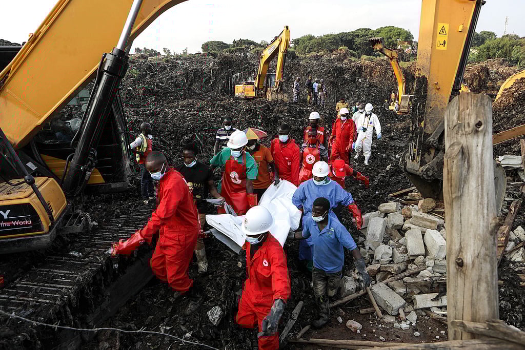 | Photo: AP : Uganda Garbage Dump Landslide: Death Toll Rises To 21, Rescue Ops Underway